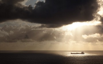 Image of a ship in the middle of teh ocean