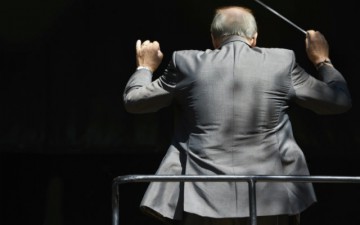 Image of a conductor conducting an orchestra