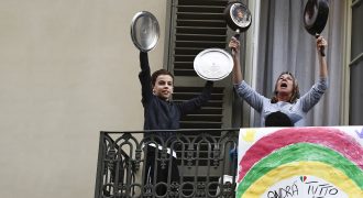 image of a woman and a boy holding pans up in the air
