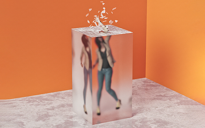 woman breaking through glass ceiling